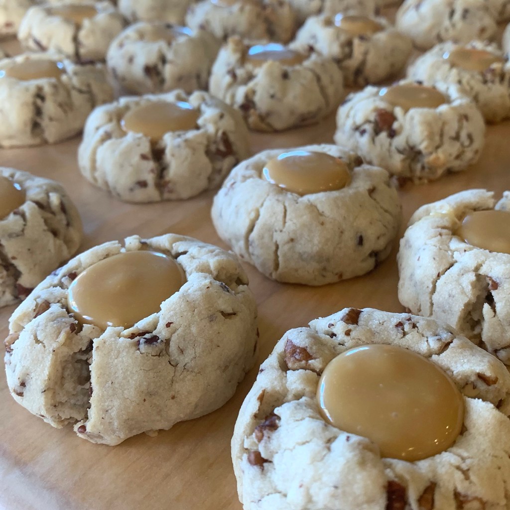 Butter Pecan Thumbprint Cookies with a White Chocolate Carmel Center